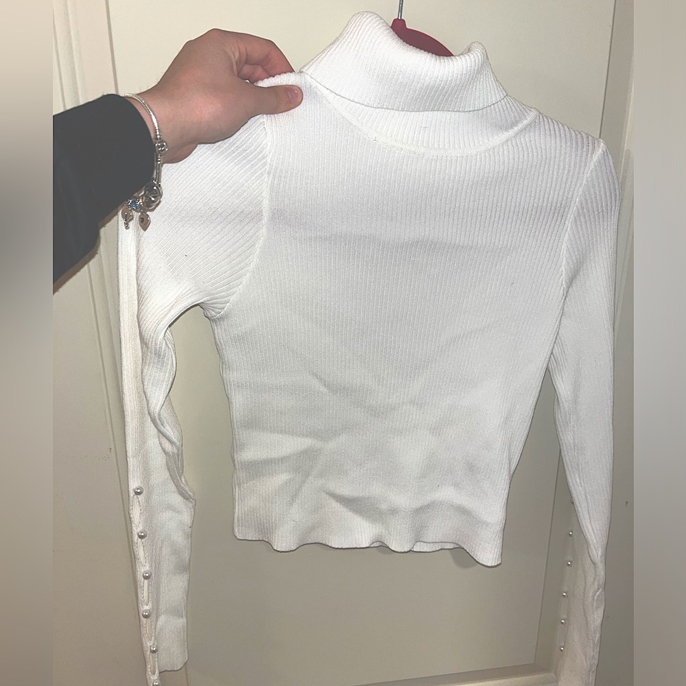 White Turtle Neck with Pearls on sleeves